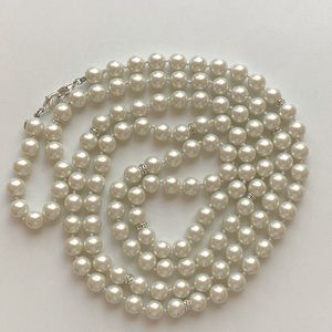 Vintage pearls - 56 inches. Heavy, excellent quality.